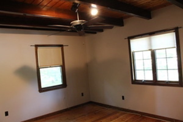 30 Birchmeadow Road Amesbury, MA 01913 - Photo 19 of 26 a view of an empty room with a window and wooden floor