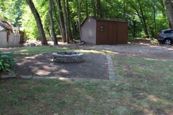 30 Birchmeadow Road Amesbury, MA 01913 - Photo 24 of 26 a view of a house with backyard and trees