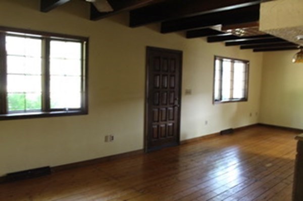 30 Birchmeadow Road Amesbury, MA 01913 - Photo 6 of 26 an empty room with wooden floor and windows