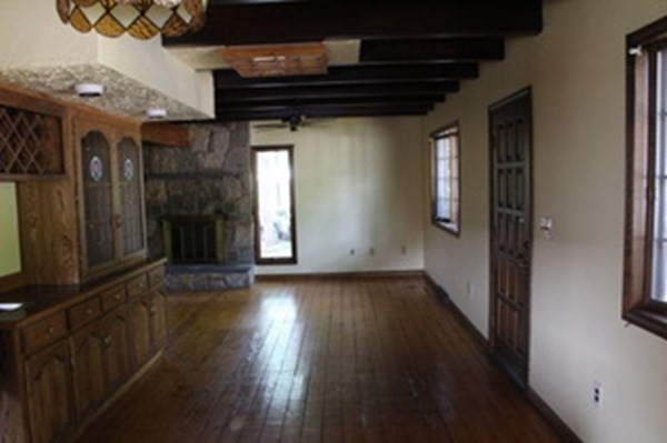 30 Birchmeadow Road Amesbury, MA 01913 - Photo 9 of 26 a view of a hallway with wooden floor and staircase