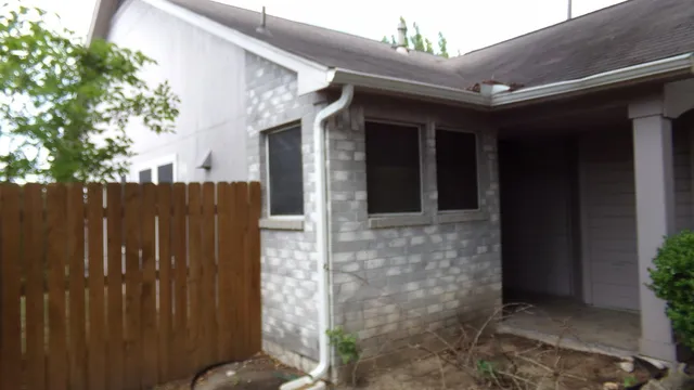 a front view of house with yard and trees