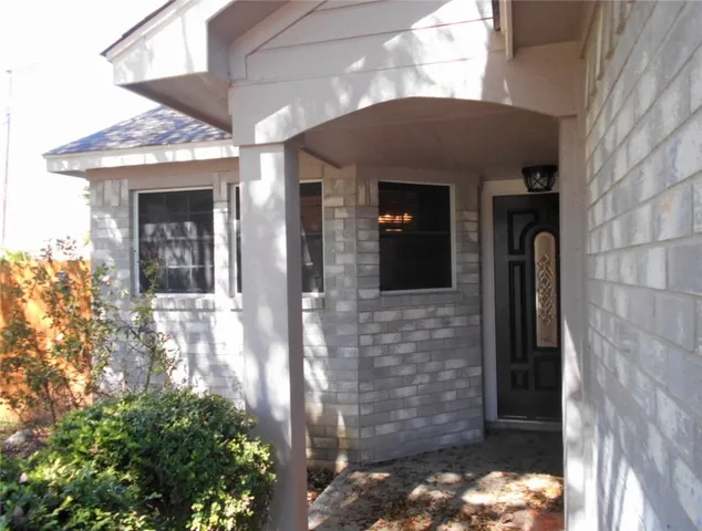 a view of a living room with a large window