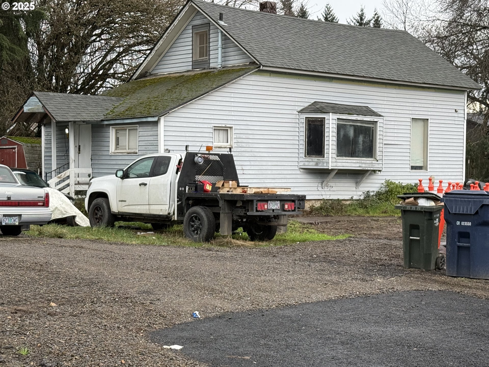 a view of a house with a cars park