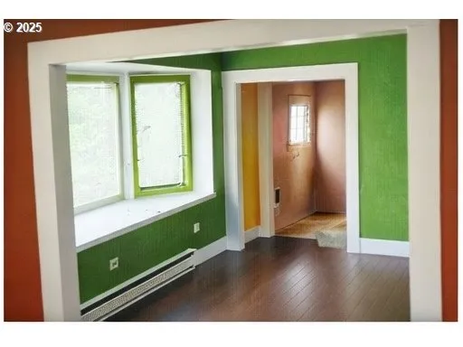 a view of a room that has a large window