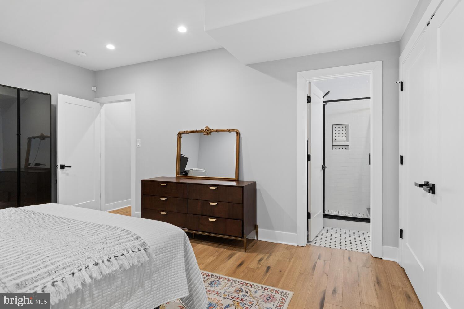 1224 North 26th Street, Unit F1 Philadelphia, PA 19121 - Photo 22 of 25 Modern elegance in a serene bedroom retreat.