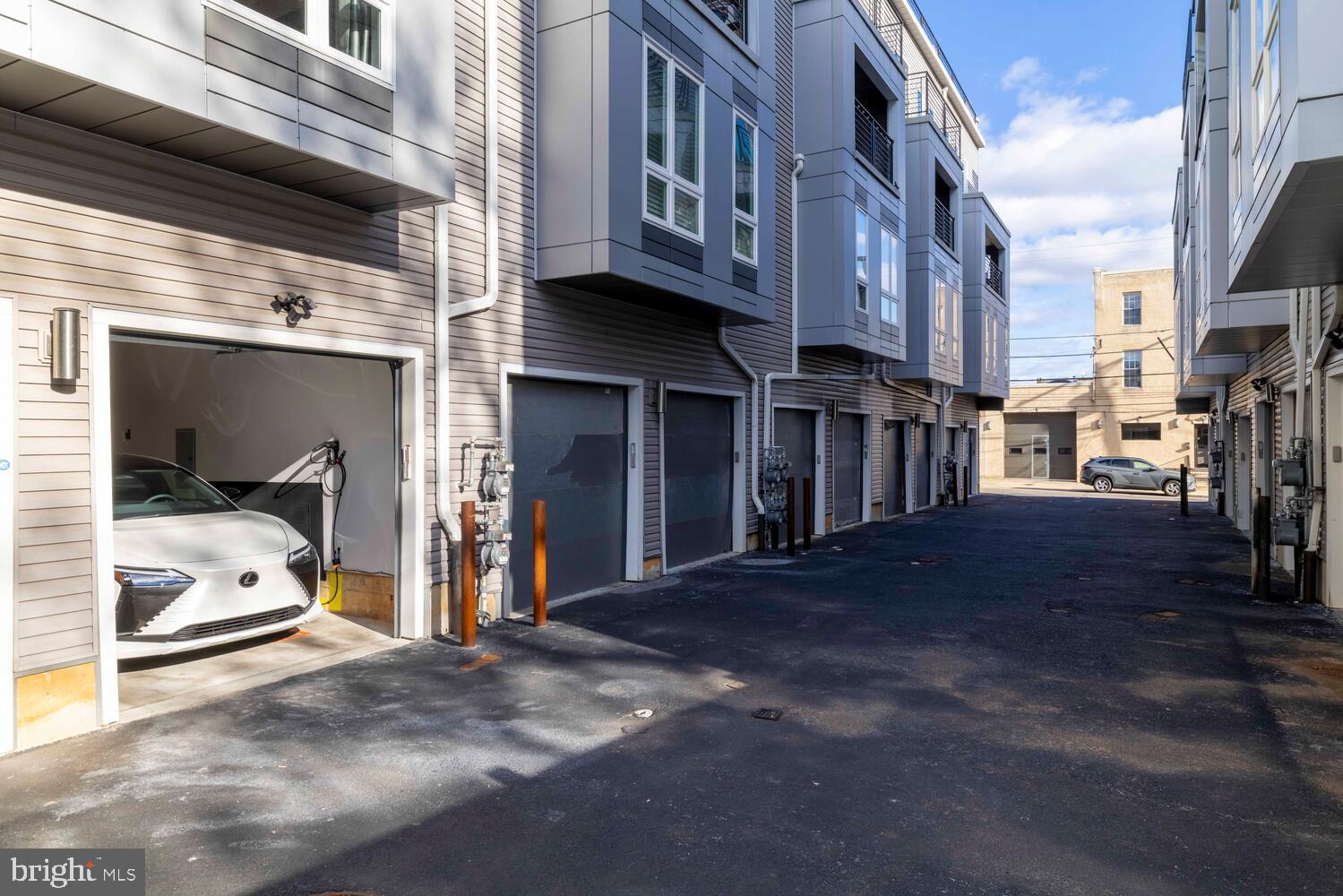 1224 North 26th Street, Unit F1 Philadelphia, PA 19121 - Photo 3 of 25 Modern townhomes with sleek garage access.