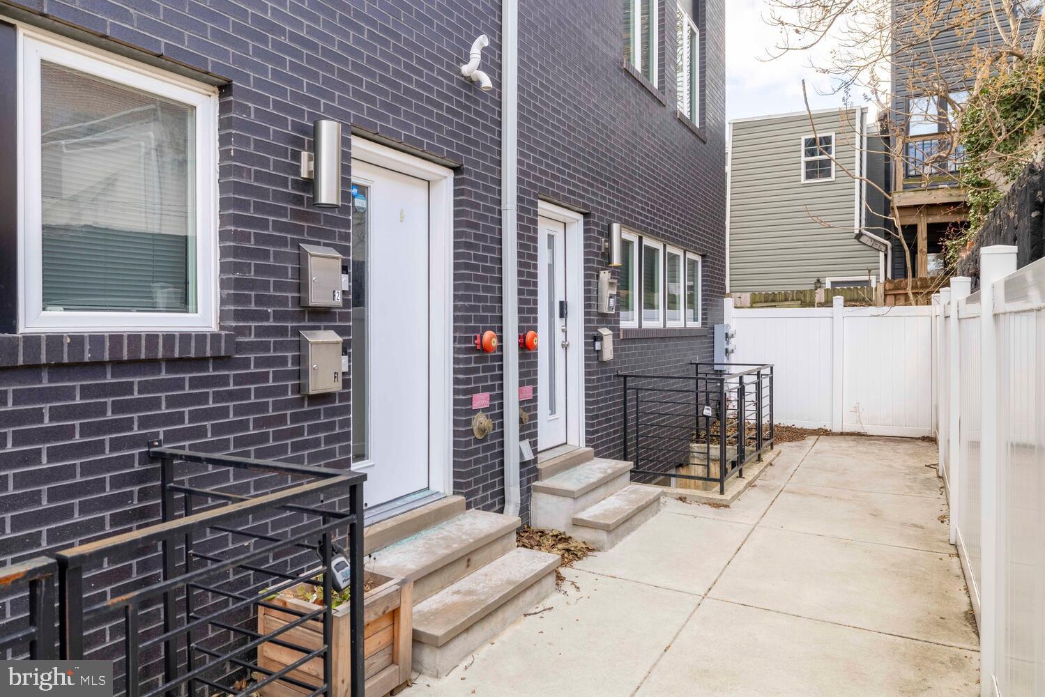 1224 North 26th Street, Unit F1 Philadelphia, PA 19121 - Photo 4 of 25 Modern duplex with sleek brick facade.