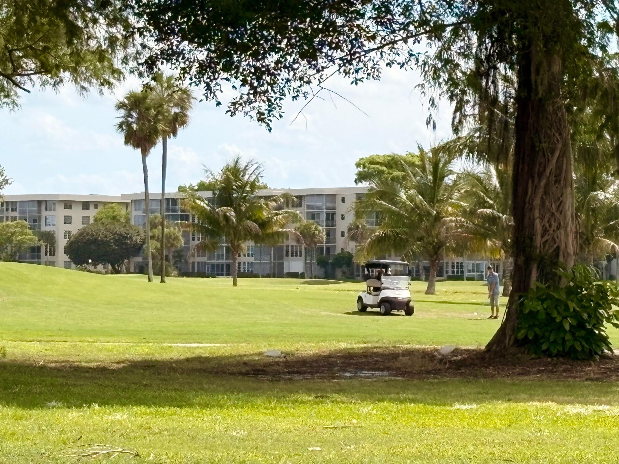 2671 South Course Drive, Unit 108 Pompano Beach, FL 33069 - Photo 36 of 40 a view of a city with tall trees