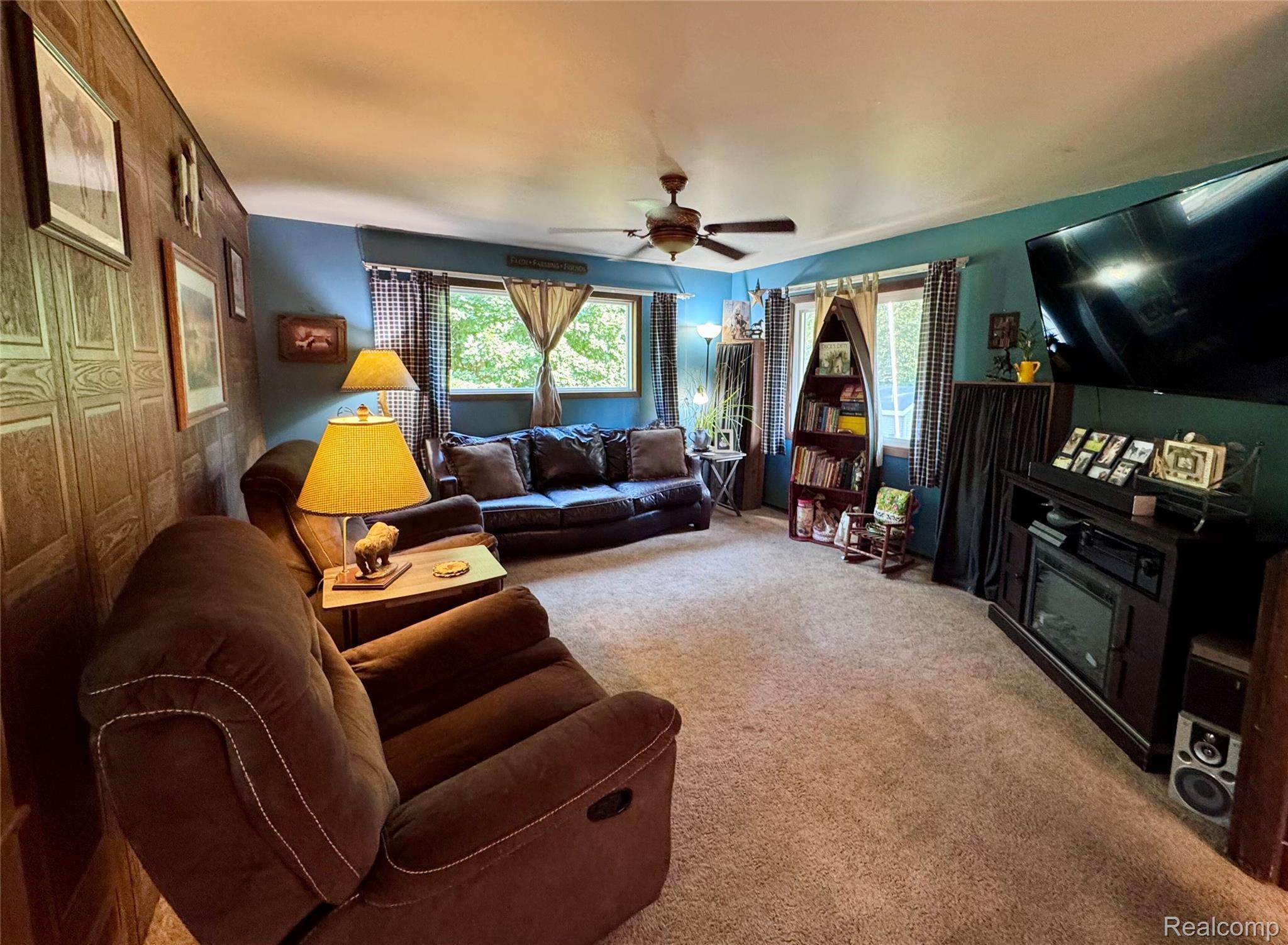 2850 Tin Bill Road Caro, MI 48723 - Photo 4 of 10 Spacious room featuring carpeting, two windows with drapes, and a ceiling fan