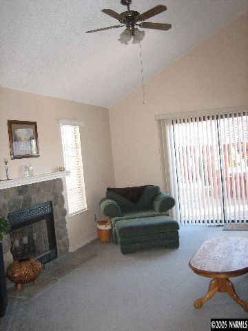 1070 Backer Way Reno, NV 89523 - Photo 3 of 8 a living room with furniture and a fireplace