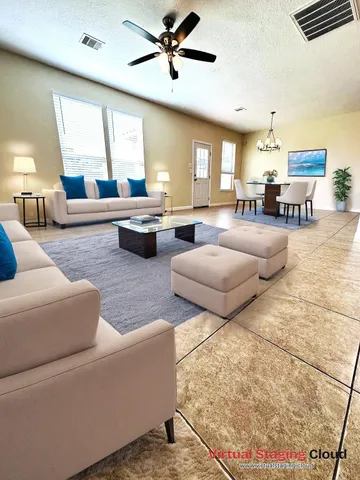 a living room with furniture and a large window