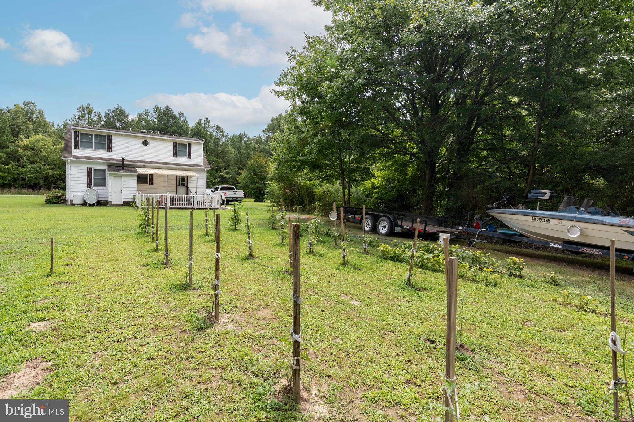 5614 Casson Neck Cambridge, MD 21613 - Photo 11 of 38 a view of a swimming pool with a yard
