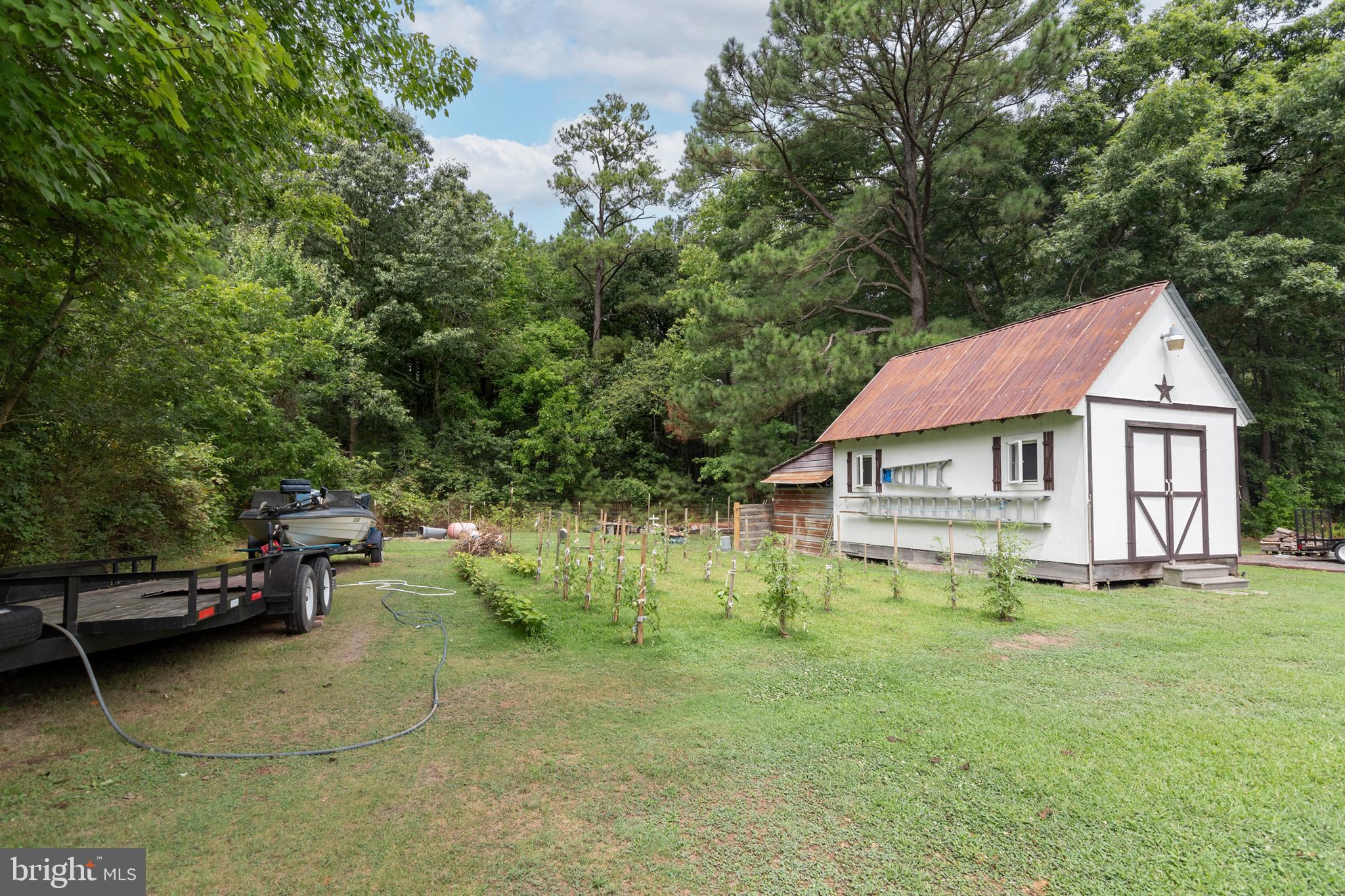 5614 Casson Neck Cambridge, MD 21613 - Photo 13 of 38 a view of a house with a yard