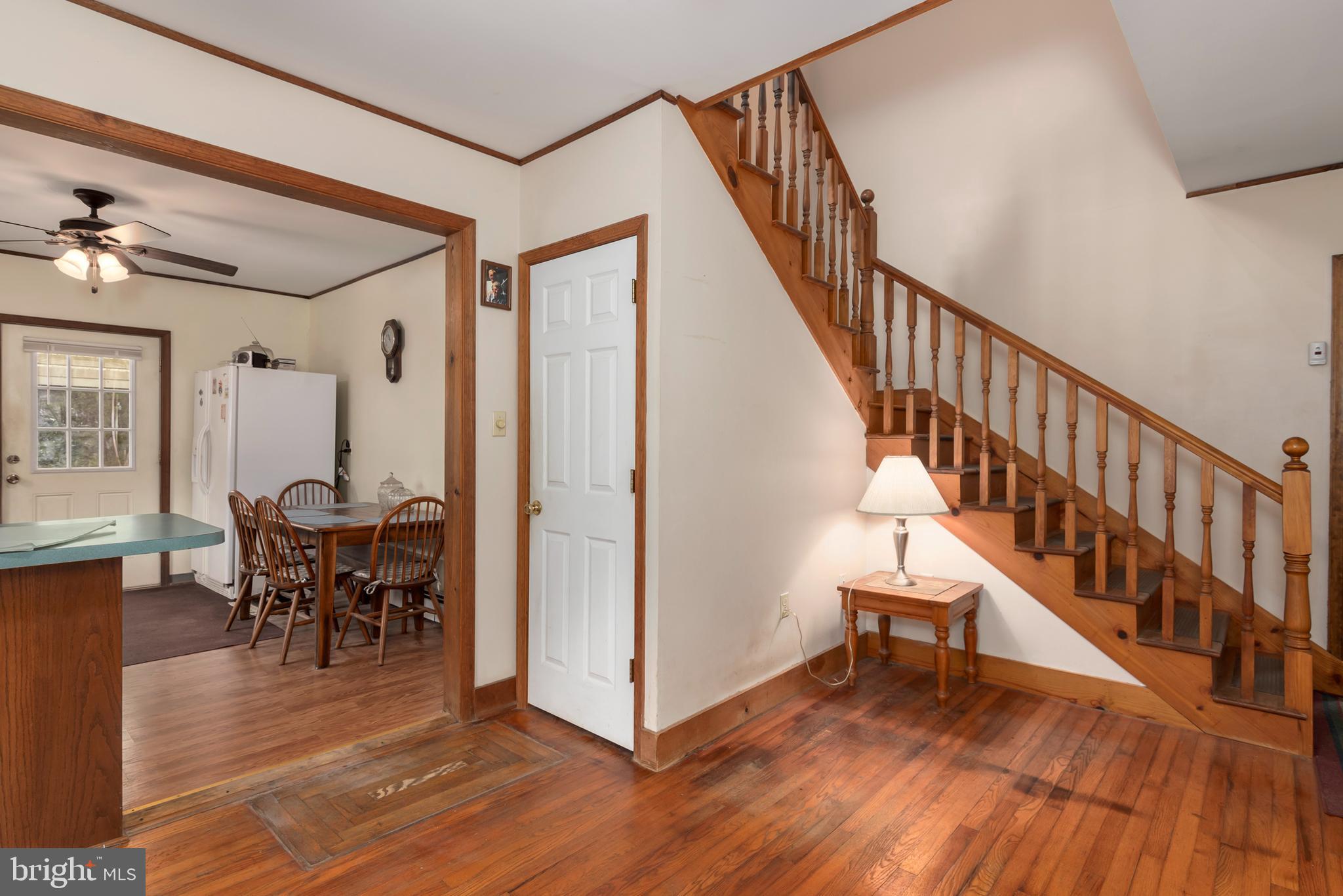 5614 Casson Neck Cambridge, MD 21613 - Photo 16 of 38 a view of a livingroom with furniture and hardwood floor