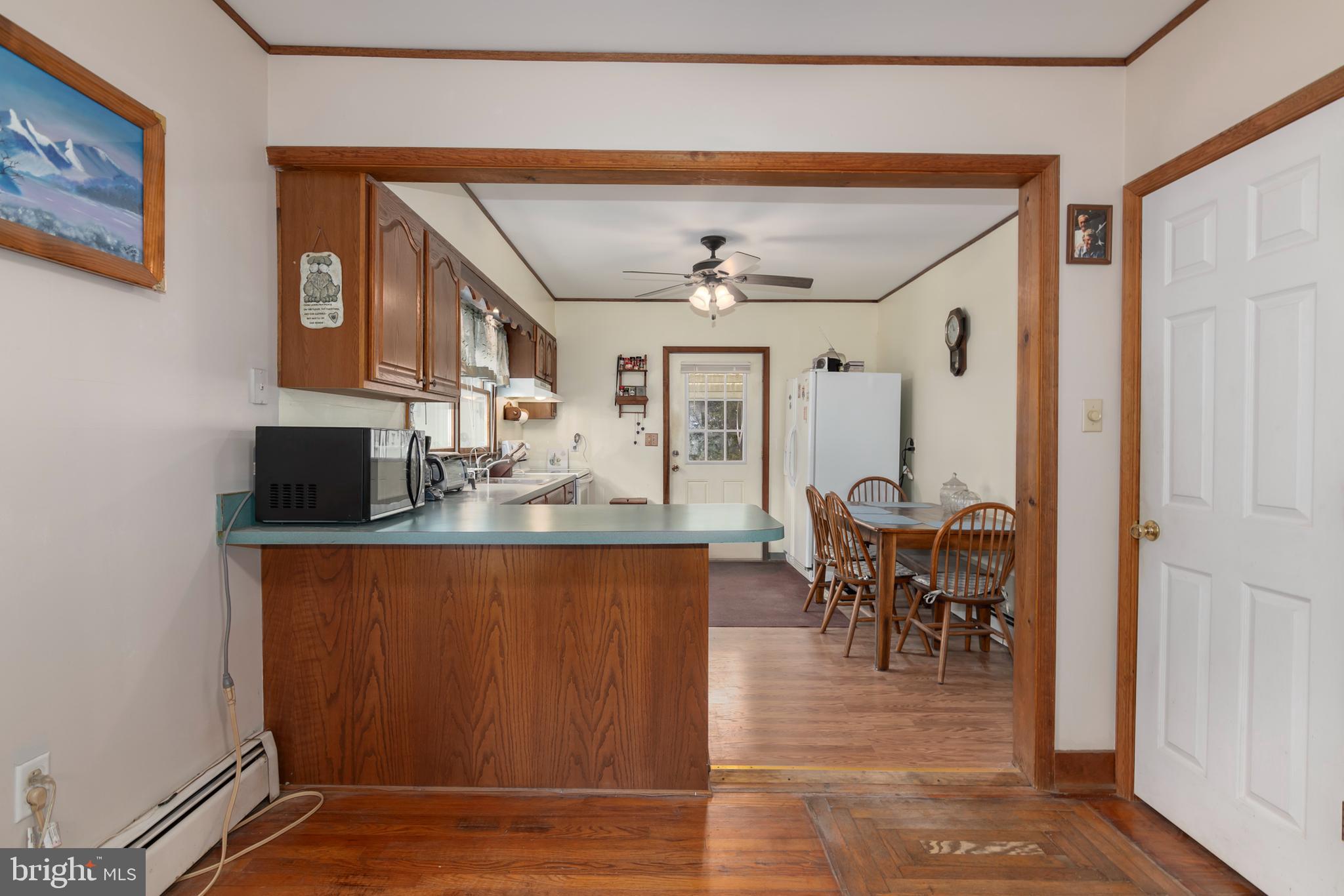 5614 Casson Neck Cambridge, MD 21613 - Photo 18 of 38 a view of dining room with furniture and wooden floor