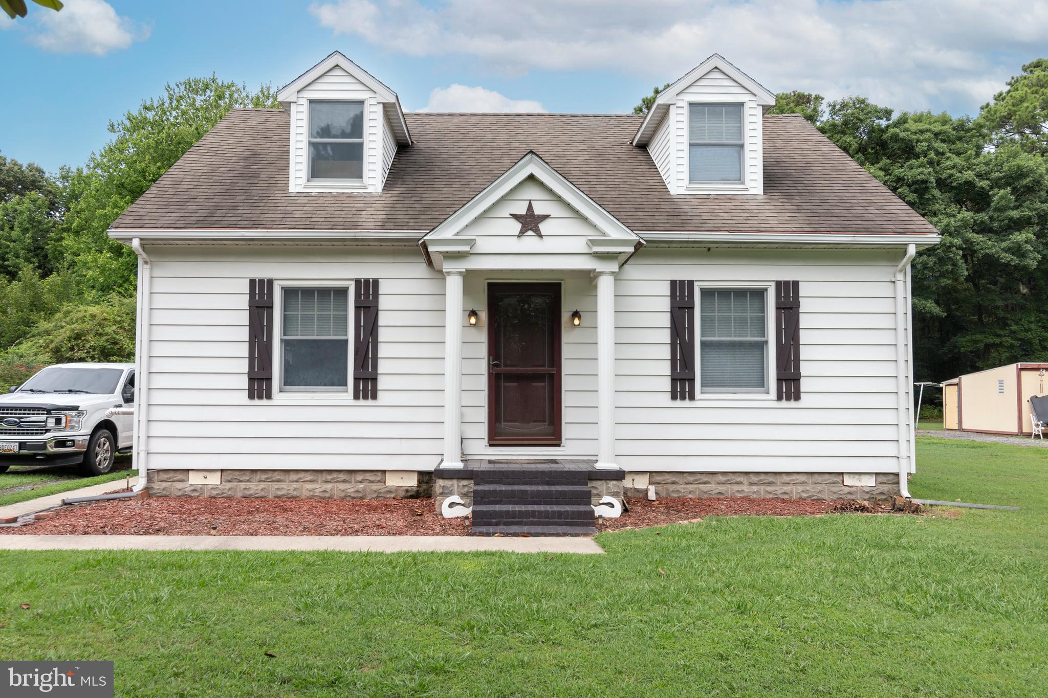 5614 Casson Neck Cambridge, MD 21613 - Photo 2 of 38 a view of front of house with a yard