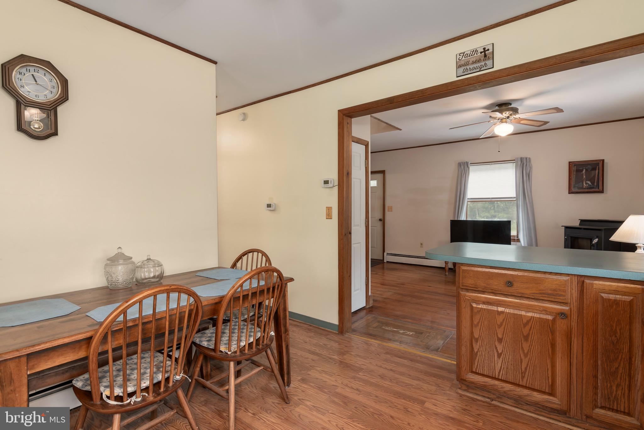 5614 Casson Neck Cambridge, MD 21613 - Photo 22 of 38 a view of a dining room with furniture and wooden floor