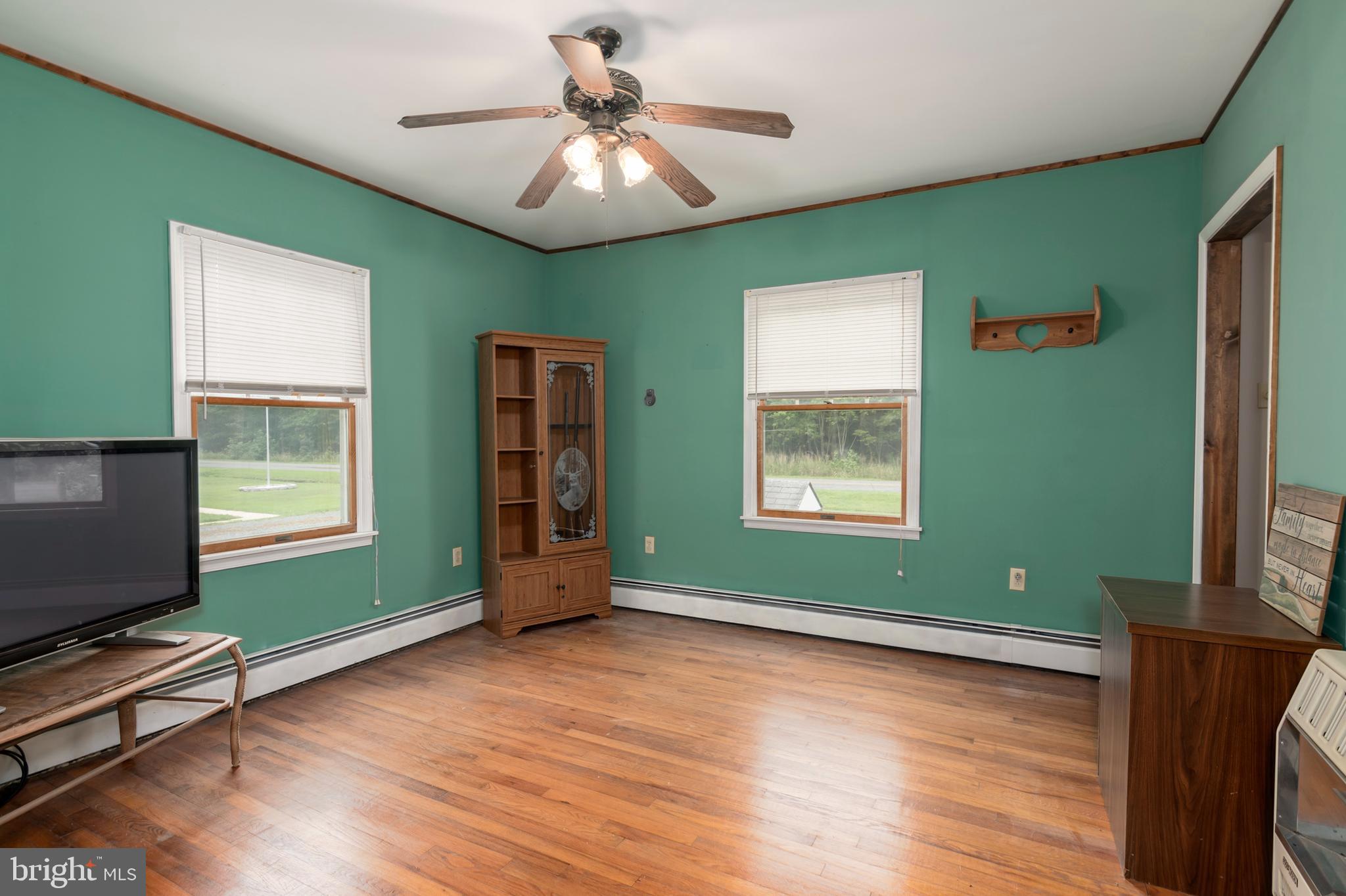 5614 Casson Neck Cambridge, MD 21613 - Photo 23 of 38 a living room with furniture and a flat screen tv