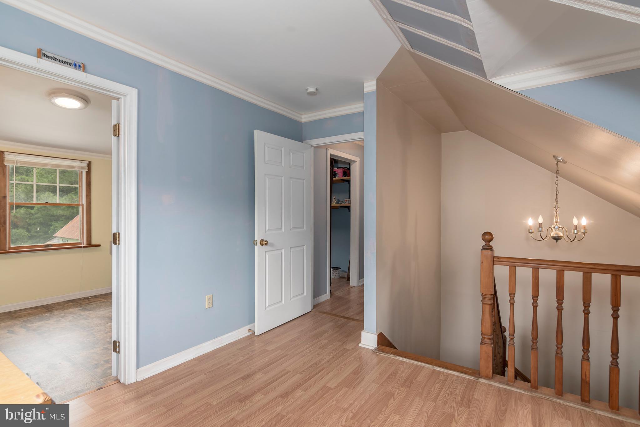 5614 Casson Neck Cambridge, MD 21613 - Photo 28 of 38 a view of a hallway with wooden floor and entryway