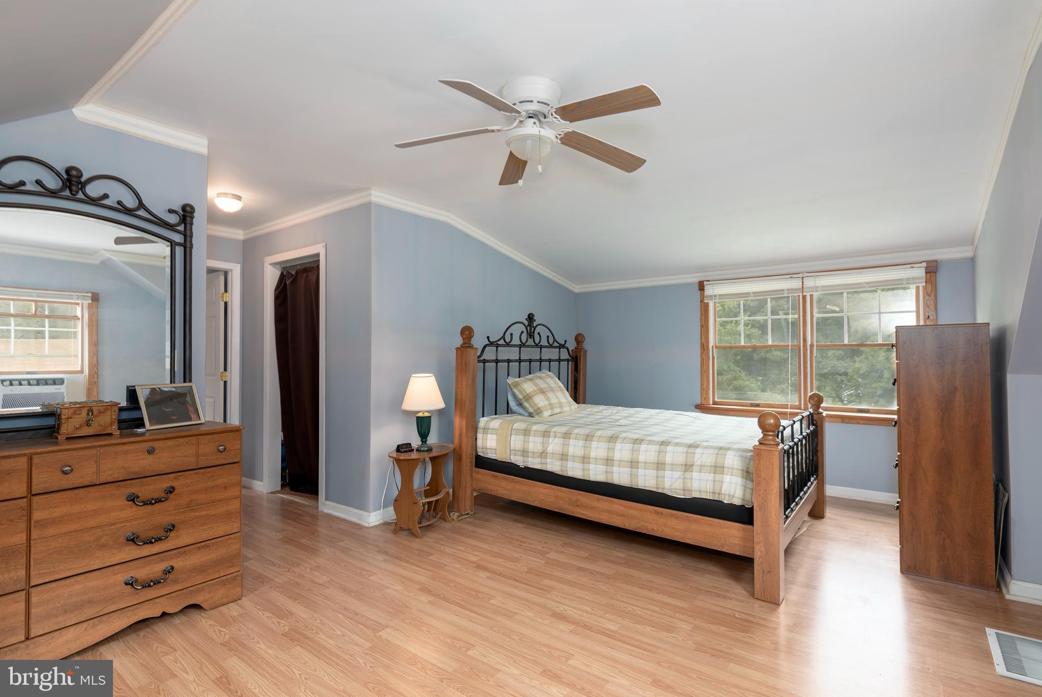 5614 Casson Neck Cambridge, MD 21613 - Photo 30 of 38 a bedroom with a bed and a table