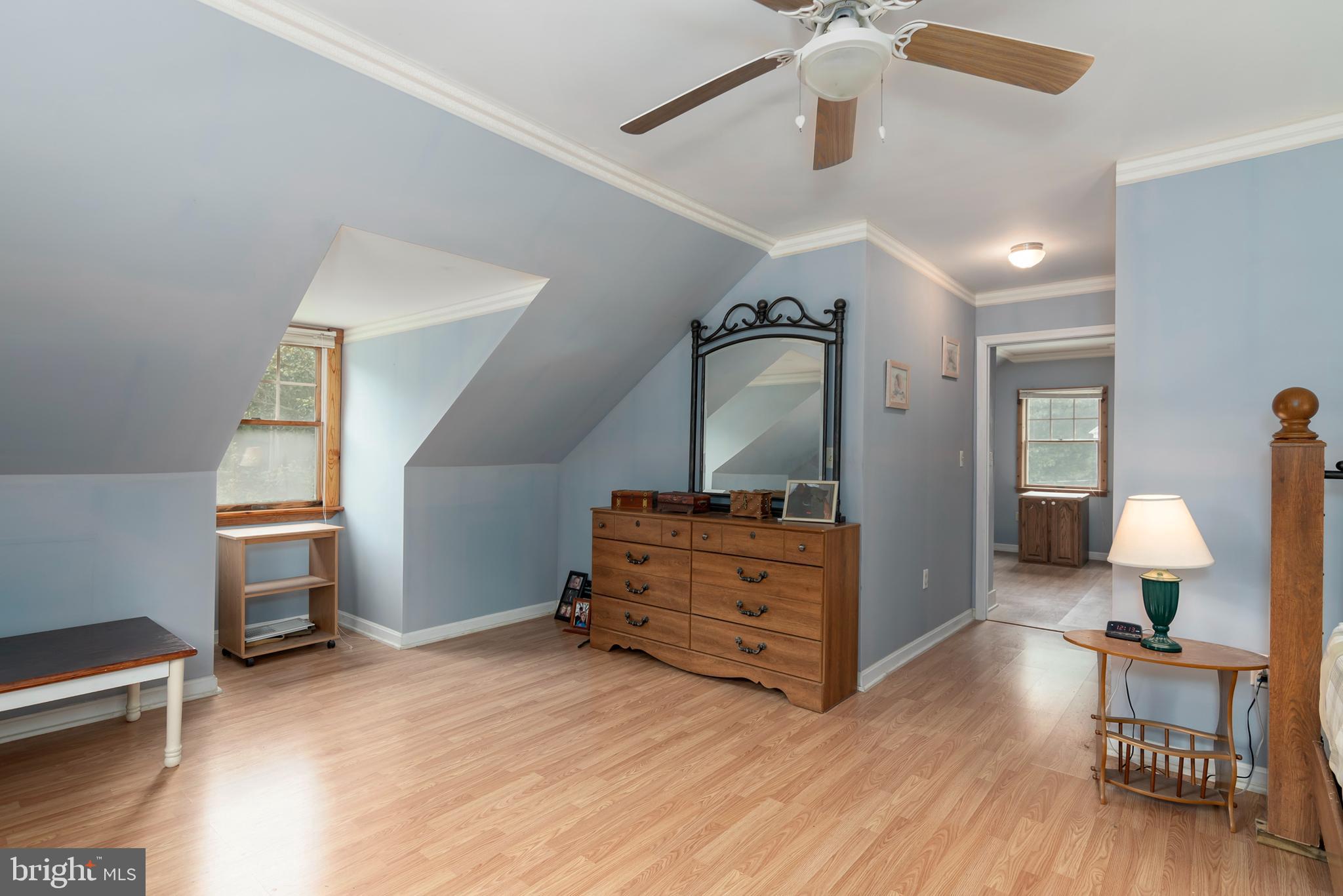 5614 Casson Neck Cambridge, MD 21613 - Photo 31 of 38 a bedroom with furniture and wooden floor