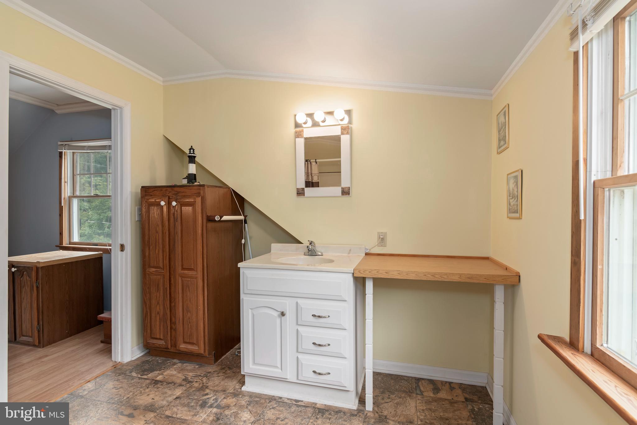 5614 Casson Neck Cambridge, MD 21613 - Photo 33 of 38 a utility room with a window and washer