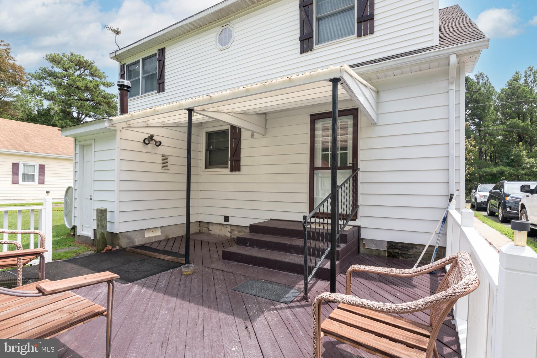 5614 Casson Neck Cambridge, MD 21613 - Photo 7 of 38 a view of a two chairs in the patio