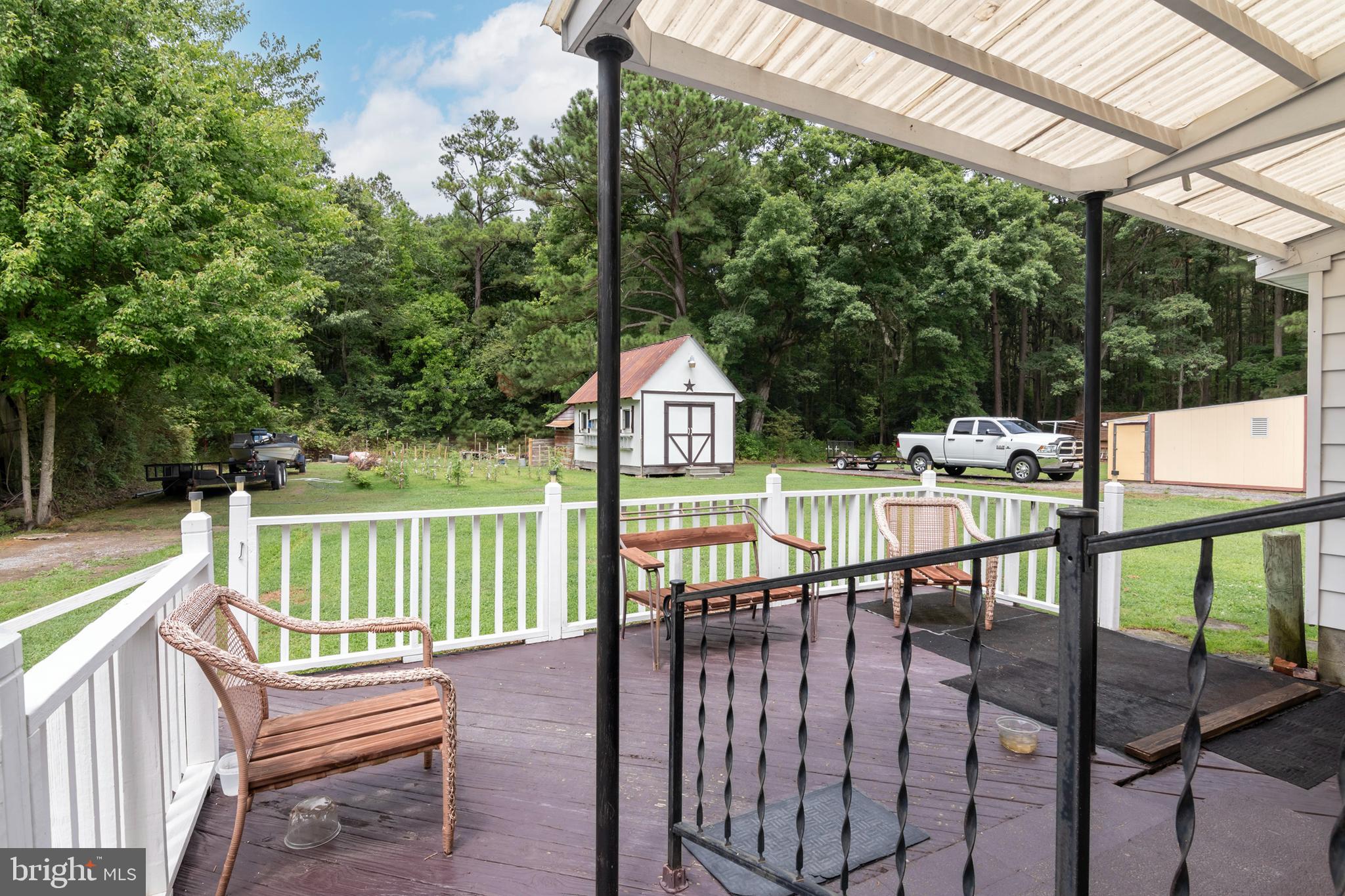 5614 Casson Neck Cambridge, MD 21613 - Photo 9 of 38 a view of a chairs and table in the balcony