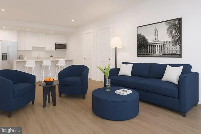 a living room with furniture and a painting