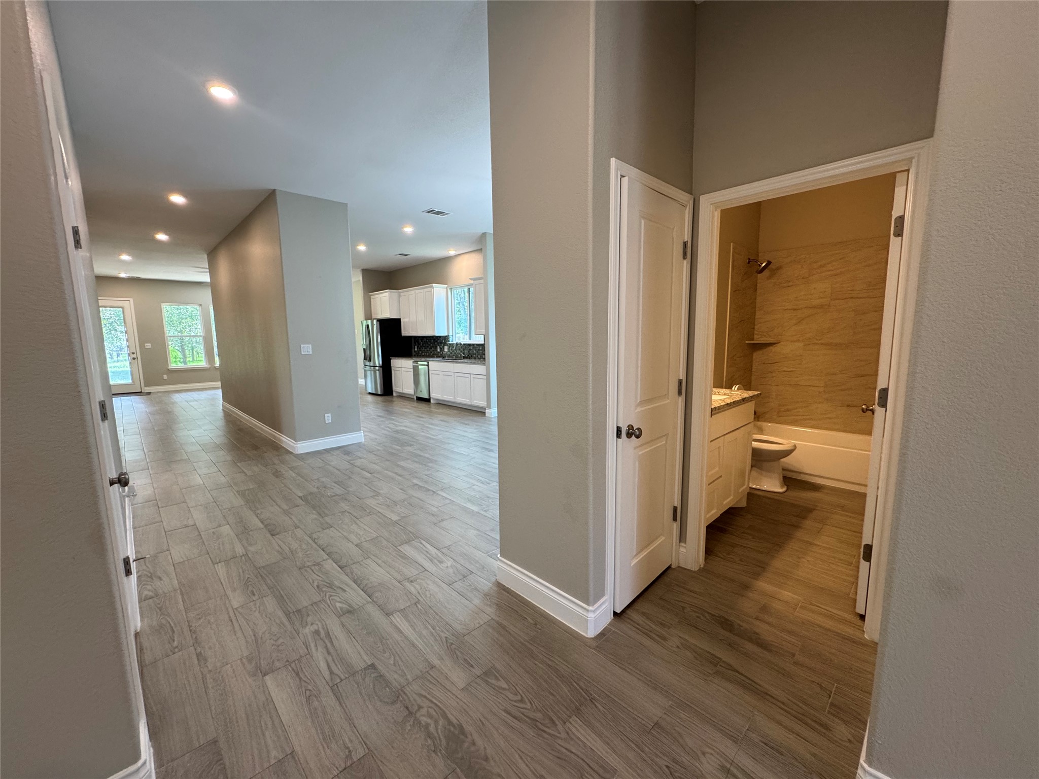 109 Mokulua Bastrop, TX 78602 - Photo 12 of 32 wooden floor and a hallway with wooden floor