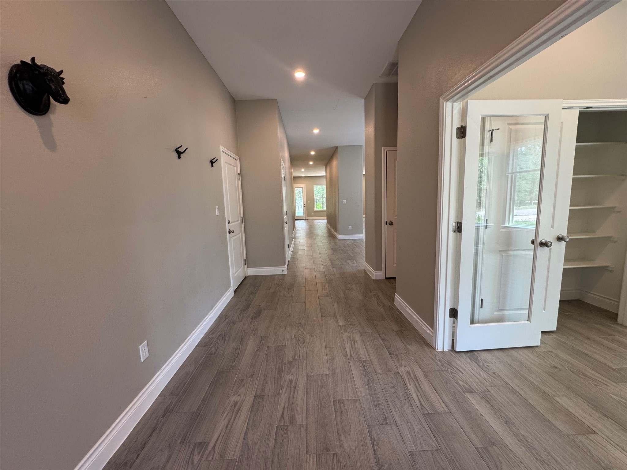 109 Mokulua Bastrop, TX 78602 - Photo 8 of 32 a view of a hallway with wooden floor