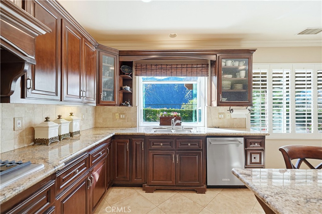 10 Boulder Ridge Court Azusa, CA 91702 - Photo 14 of 50 a kitchen with a sink stove and cabinets