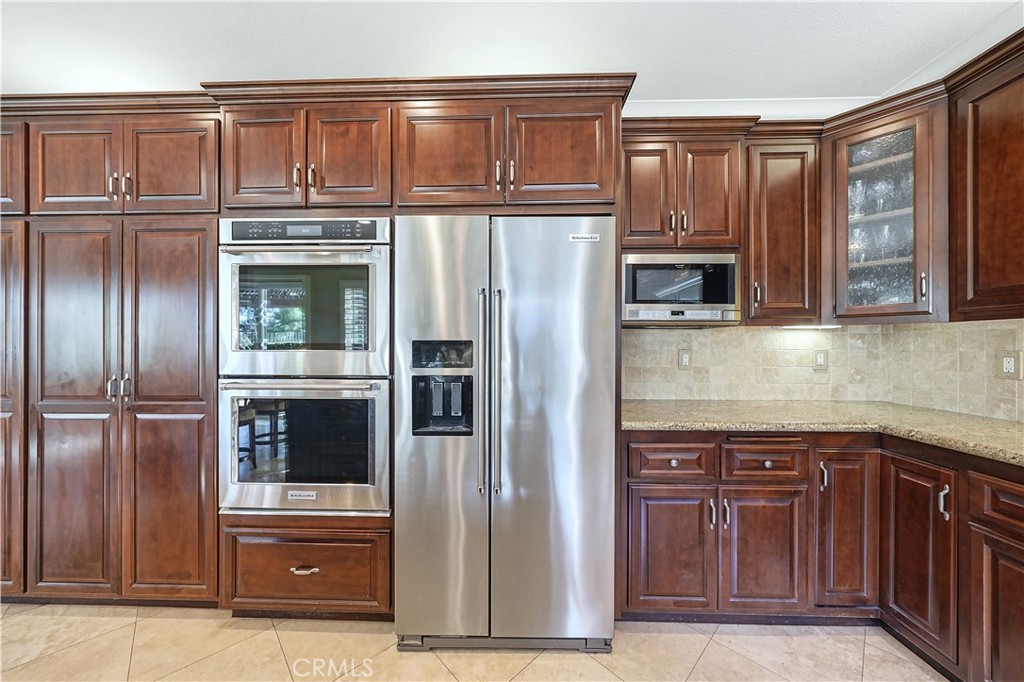 10 Boulder Ridge Court Azusa, CA 91702 - Photo 15 of 50 a kitchen with stainless steel appliances granite countertop a refrigerator and a stove top oven