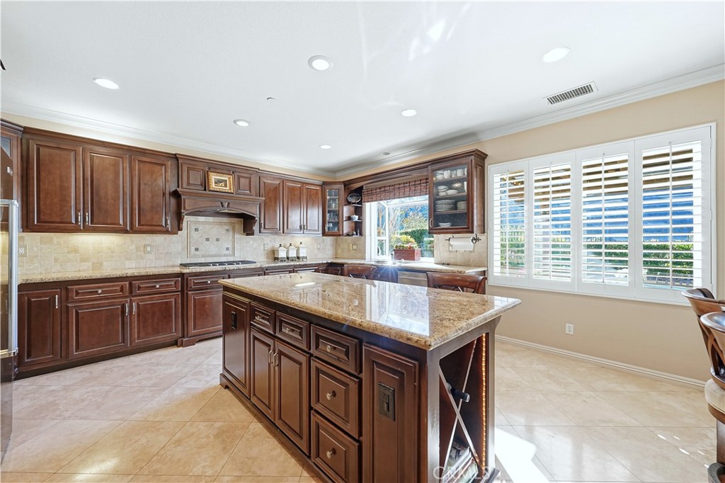 10 Boulder Ridge Court Azusa, CA 91702 - Photo 18 of 50 a kitchen with stainless steel appliances granite countertop sink stove and cabinets