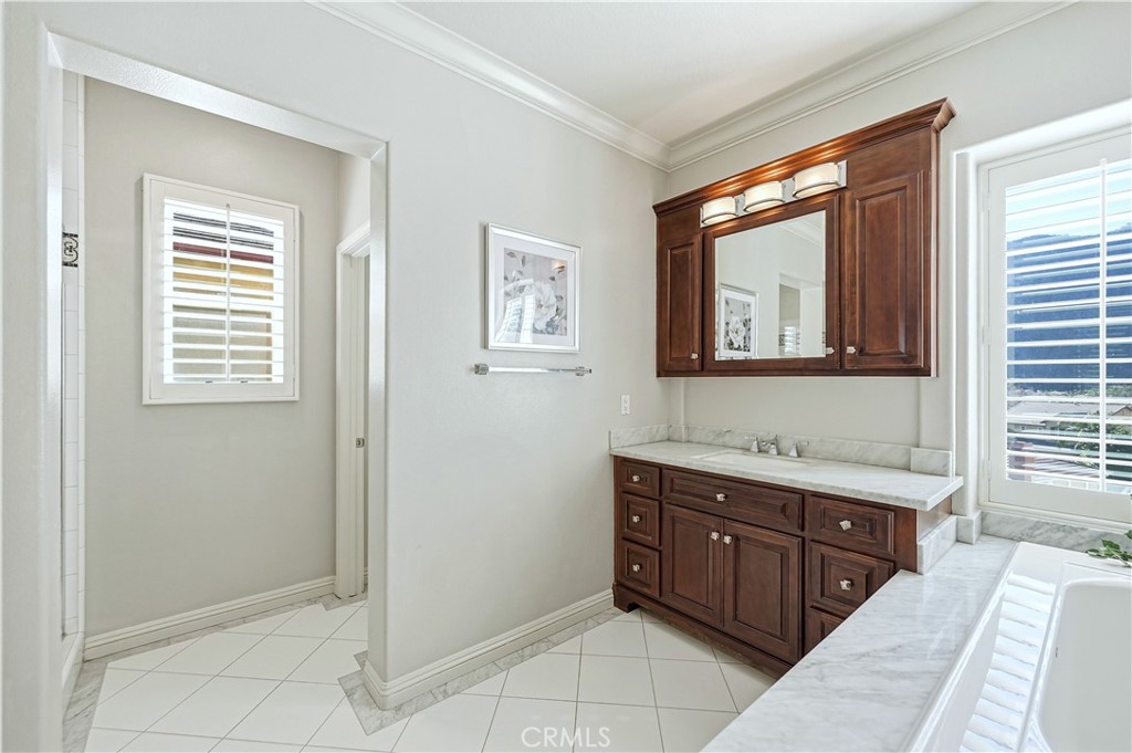 10 Boulder Ridge Court Azusa, CA 91702 - Photo 27 of 50 a spacious bathroom with a tub sink and mirror