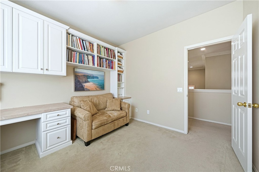 10 Boulder Ridge Court Azusa, CA 91702 - Photo 31 of 50 a living room with furniture and a book shelf