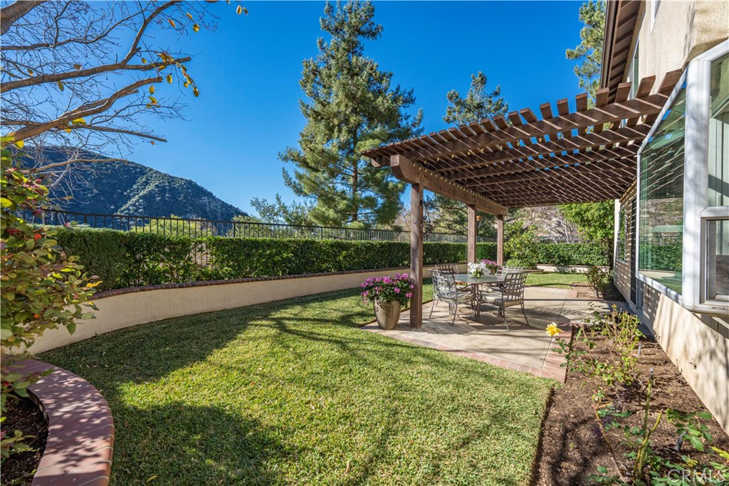 10 Boulder Ridge Court Azusa, CA 91702 - Photo 38 of 50 a view of a house with backyard sitting area and garden