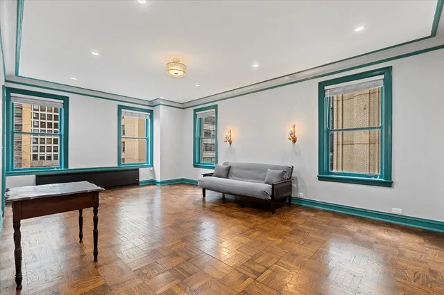 a living room with furniture and windows