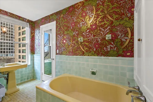 a bathroom with a bathtub and shower