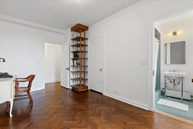 an empty room with a bench and toys