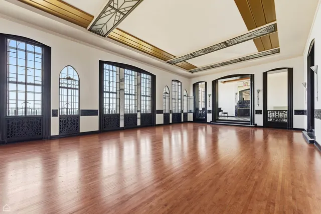 a view of an entryway with wooden floor