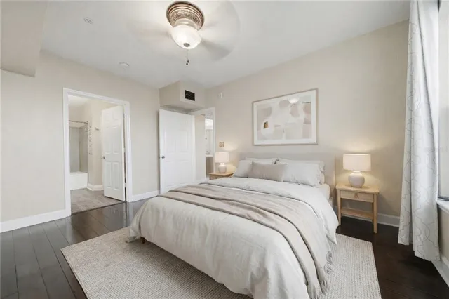 a spacious bedroom with a bed and a table