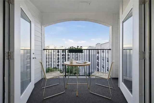 a view of a balcony with furniture