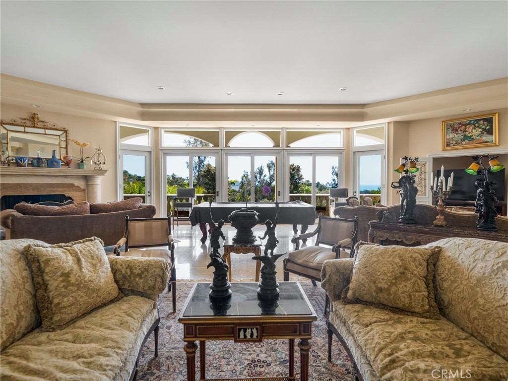 6000 Cavalleri Road Malibu, CA 90265 - Photo 19 of 44 a living room with furniture kitchen view and large windows