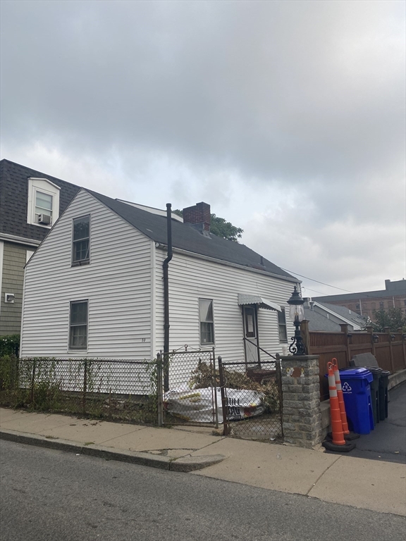 10 Dunmore Street Boston, MA 02119 - Photo 1 of 3 a view of a house with a patio