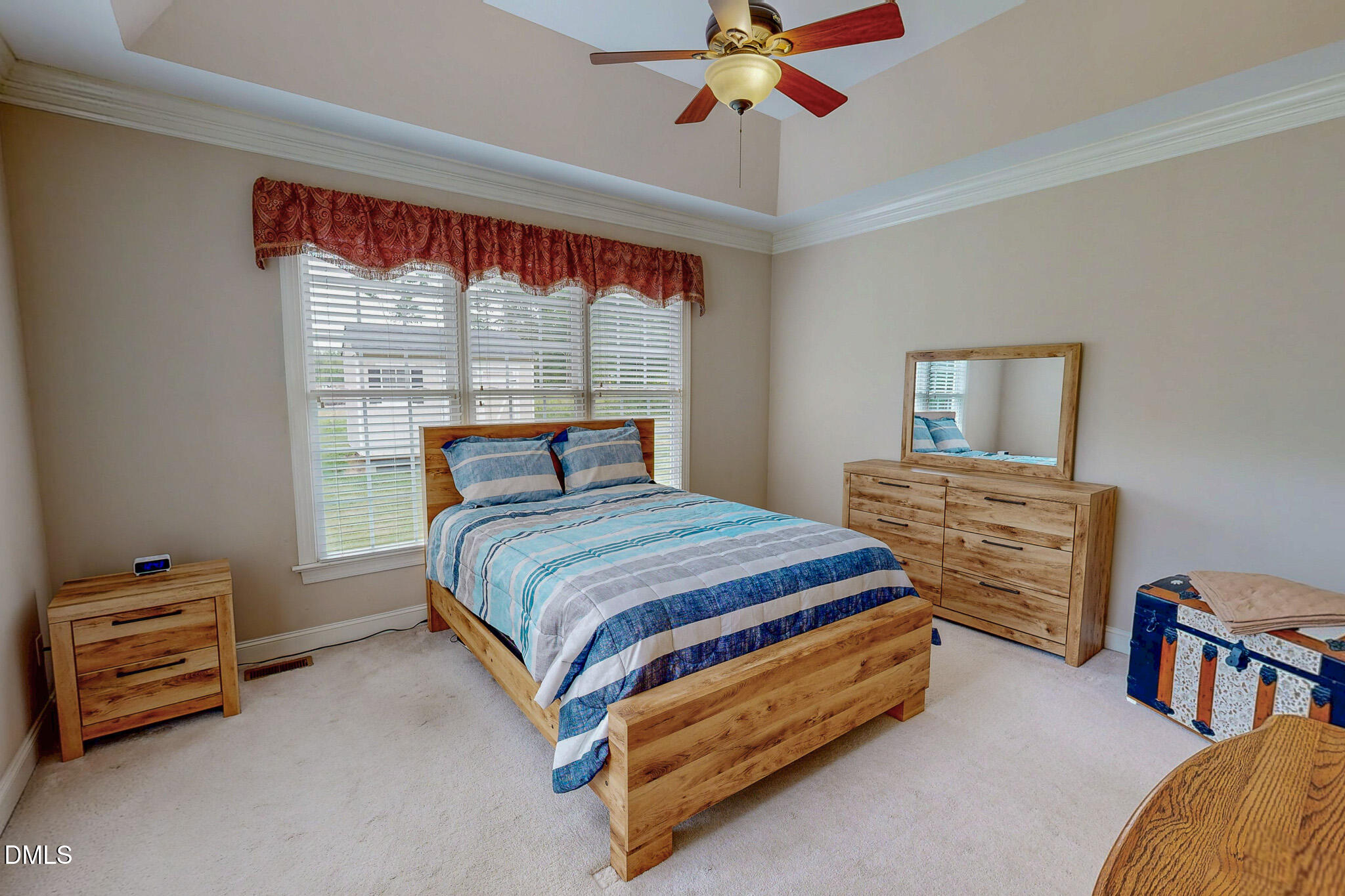 115 Duncan Plantation Road Timberlake, NC 27583 - Photo 10 of 48 a bedroom with a bed and a chandelier