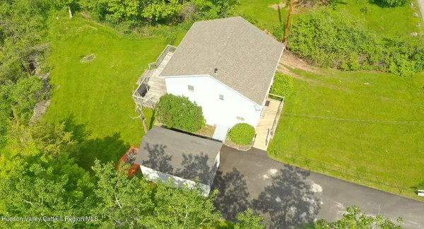 a view of a swimming pool with a yard