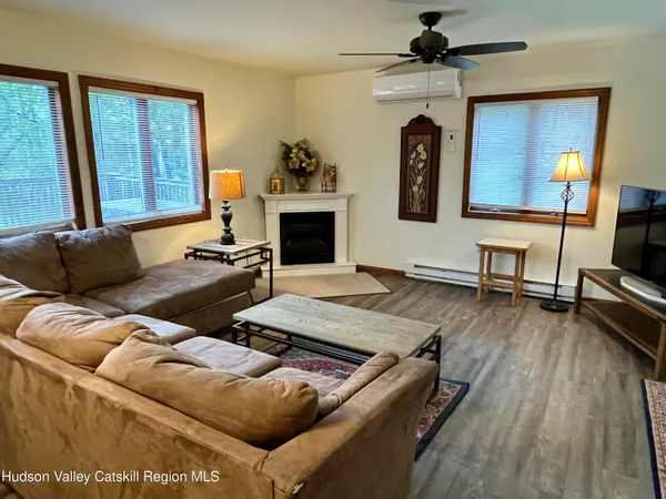 a living room with furniture and a fireplace