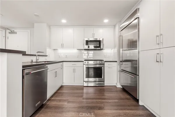 a view of kitchen with wooden floor