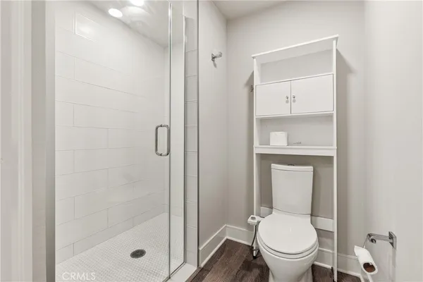 an empty room with closet and a bathroom